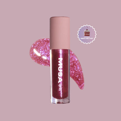 Dark pink glitter lip oil with purple glitter and red velvet scent.