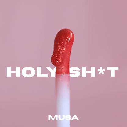 Soft and big applicator of a red glitter lip oil from Musa. Glitter Makeup.