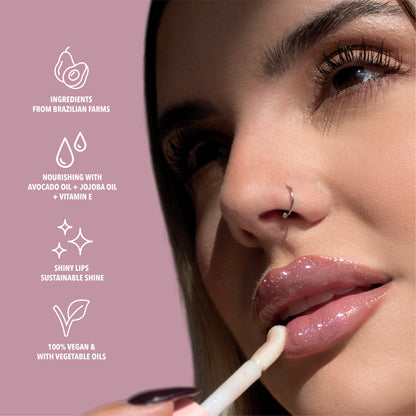 Benefits of the clear glitter lip oil. Made with avocado oil, vitamin E and jojoba oil. Vegan and Cruelty Free. Made with biodegradable glitter.