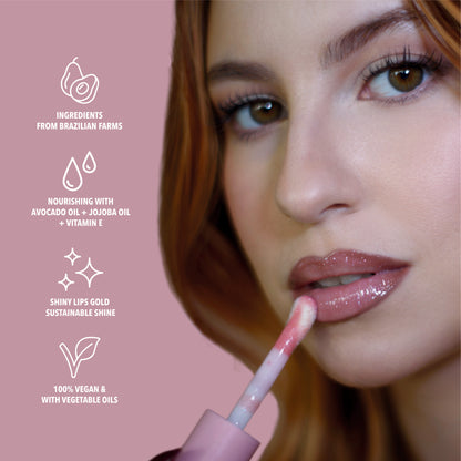 Benefits of the pink glitter lip oil. Made with avocado oil, vitamin E and jojoba oil. Vegan and Cruelty Free. Made with biodegradable glitter.